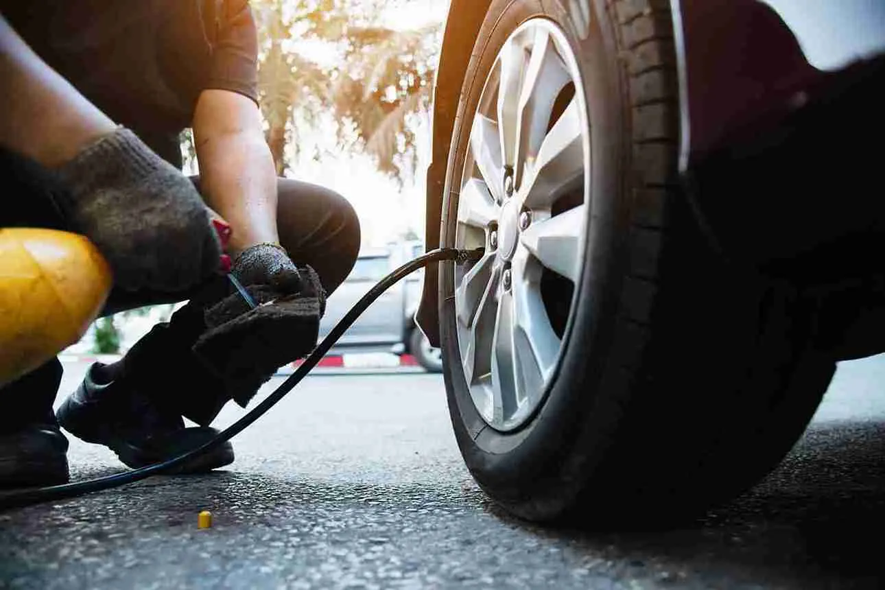 Roadside technician attending a tyre in Dubai